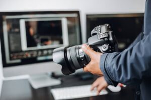 A professional photographer editing captured photos.